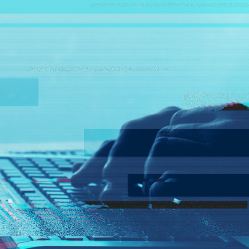 hands typing on keyboard