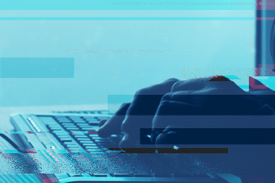 hands typing on keyboard