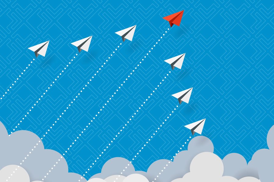 paper planes flying from the clouds