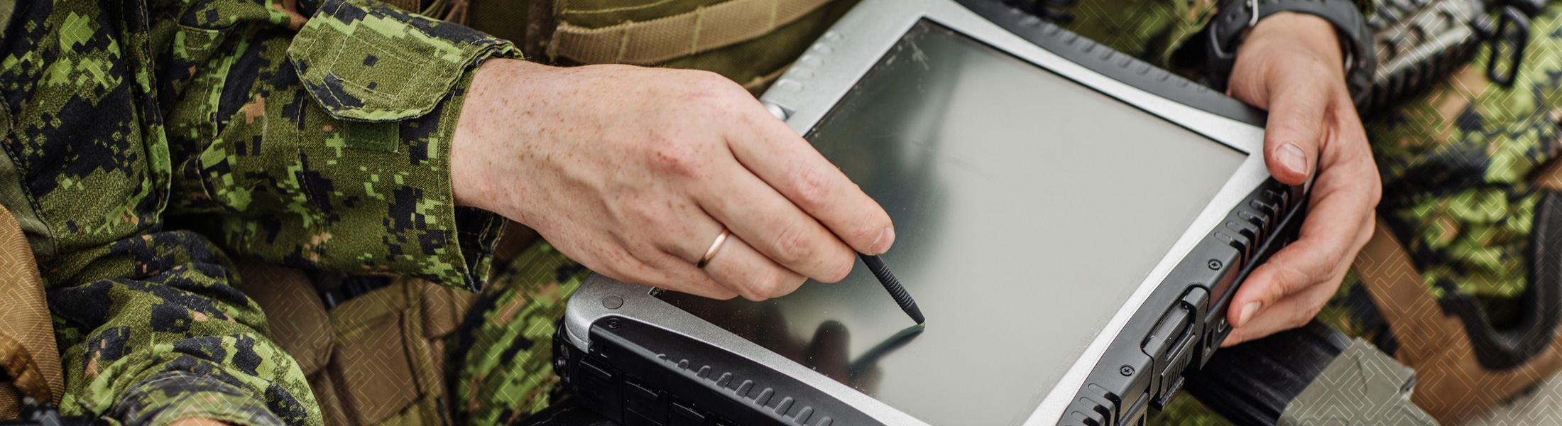 Military person writing on a ipad
