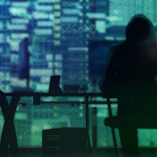 people sitting at a desk coding