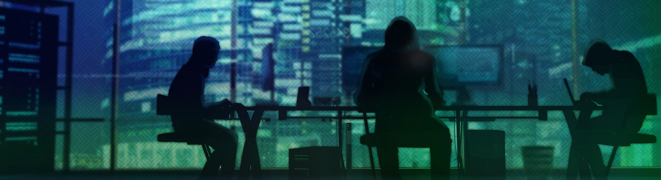 people sitting at a desk coding