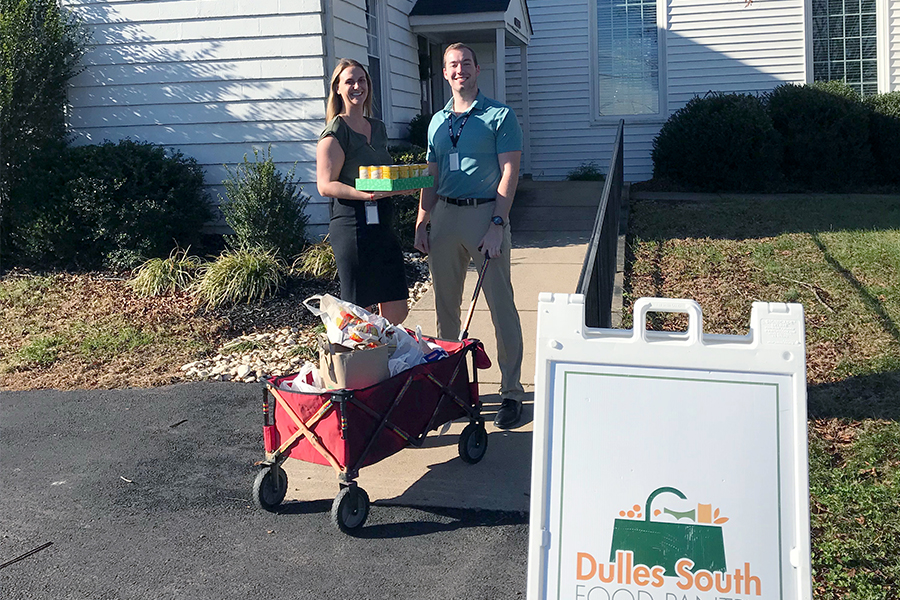 ECS employees donating to a food drive