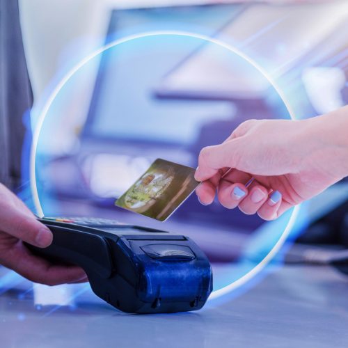 abstract image of someone checking out with credit card