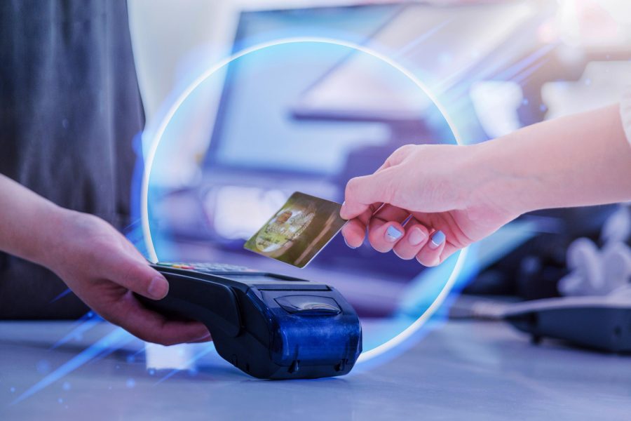 abstract image of someone checking out with credit card