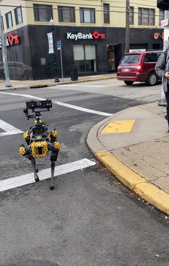 Spot, an autonomous quadruped robot, capturing data to be ingested by AI from different angles.
