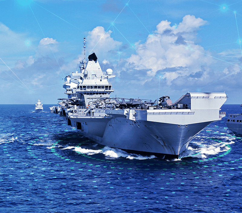 Multiple aircraft carriers and battleships are seen on the ocean.